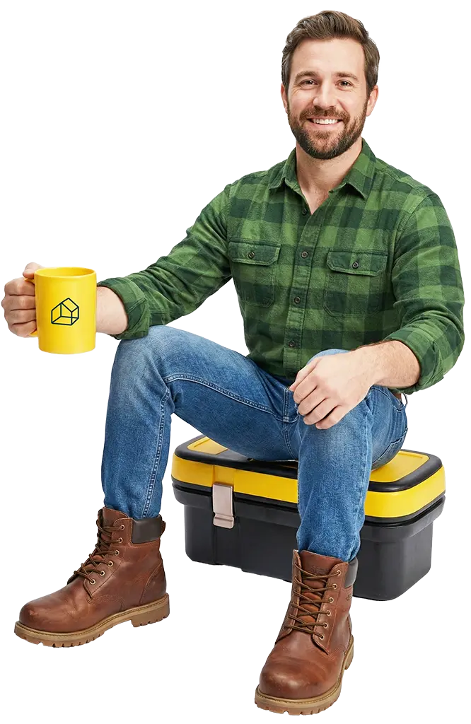 Man sitting on toolbox with a coffee, ready for a chat about Vanto